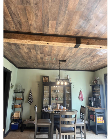 Rustic wood plank ceiling with dark metal Santa Fe Beam Wrap by Industrial Farm Co in farmhouse kitchen dining room