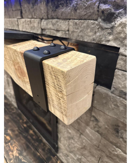 Industrial Farm Co Billings black metal beam strap wrapping around rustic wooden beam in stone fireplace setting