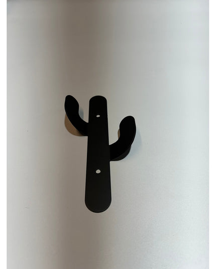 Black metal Sedona Cactus Wall Hook by Industrial Farm Co mounted on white wall with two curved arms and mounting holes