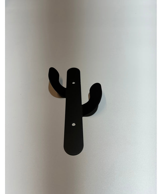 Black metal Sedona Cactus Wall Hook by Industrial Farm Co mounted on white wall with two curved arms and mounting holes