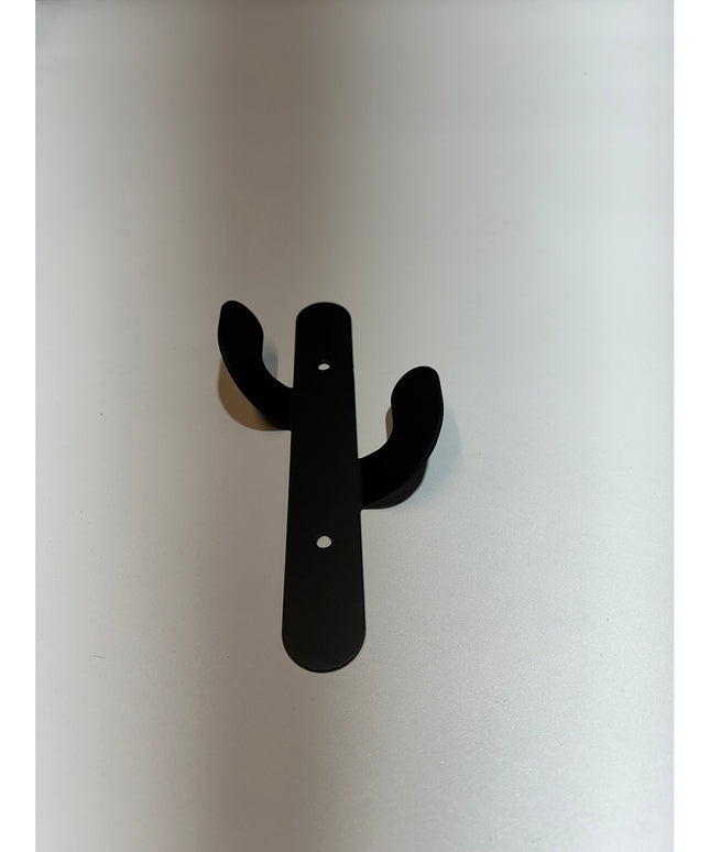 Black metal Sedona Cactus Wall Hook by Industrial Farm Co mounted on white wall with two curved arms and mounting holes