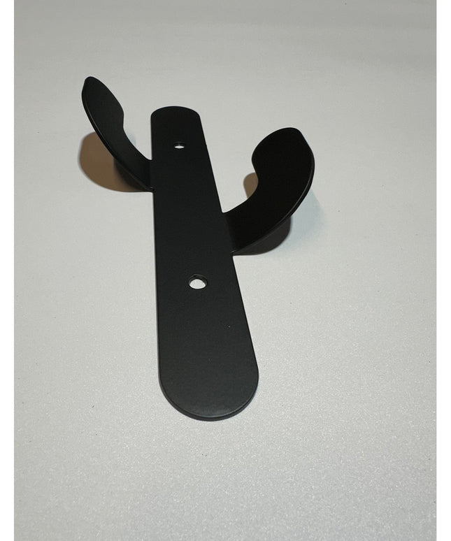 Black metal Sedona Cactus Wall Hook by Industrial Farm Co with curved arms and mounting holes on white background