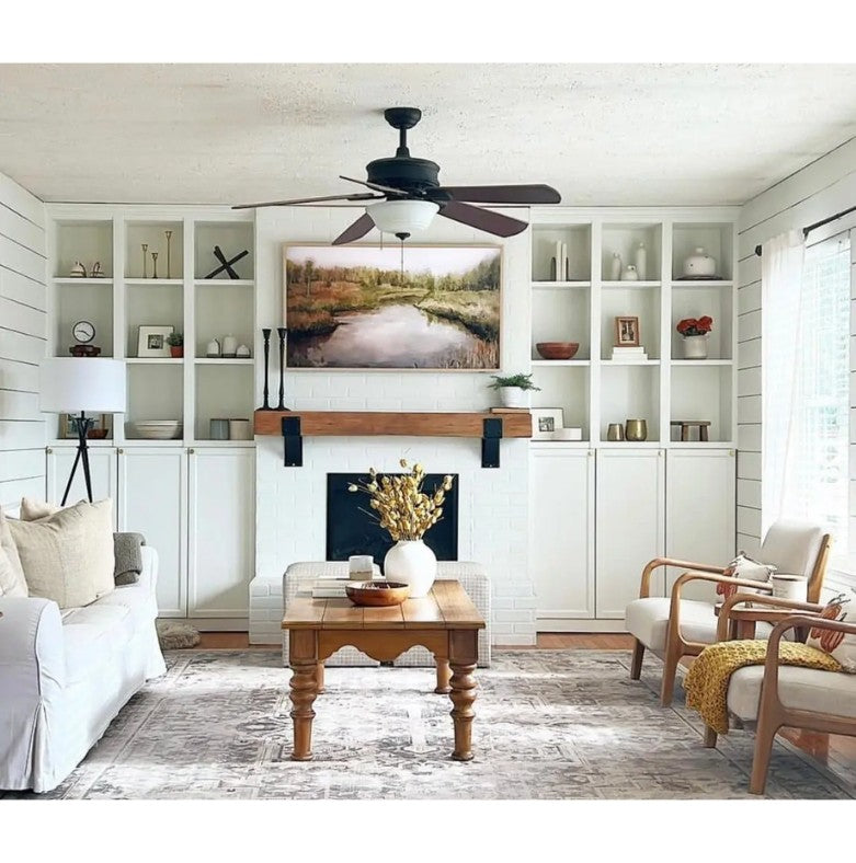 Living room with stone fireplace and Kudlick farmhouse mantel brackets