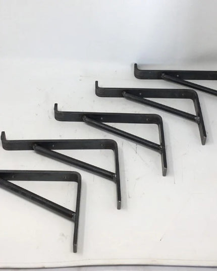 Set of 5 black metal Norwich Support Brackets by Industrial Farm Co arranged on white surface, L-shaped shelf brackets wit...