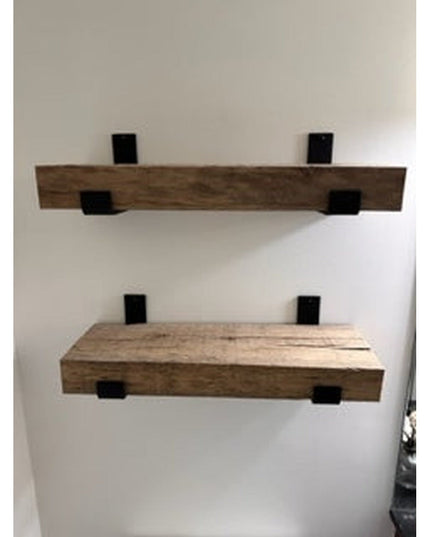 Industrial Farm Co Jane J Style black metal shelf brackets supporting two natural wood floating shelves mounted on white wall